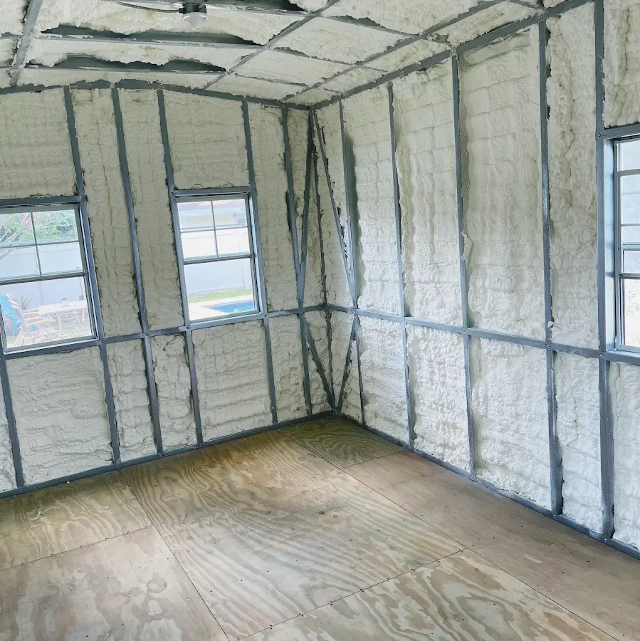 Closed-cell spray foam insulation applied to wall cavities in a residential project in Conyers