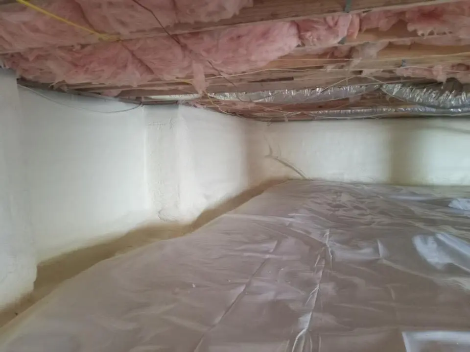 Crawl space encapsulation with closed-cell spray foam for Commercial Roof Restoration in Conyers